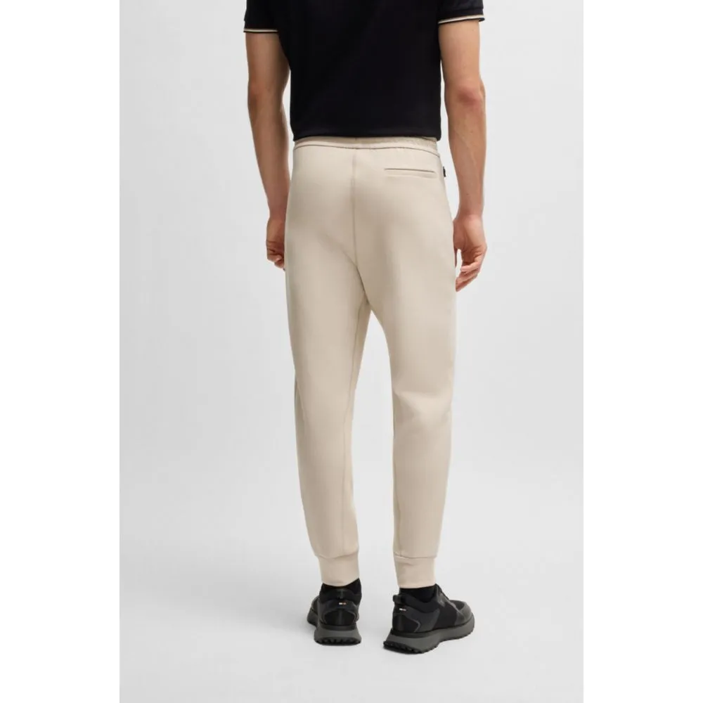 Stretch tracksuit bottoms with logo patch