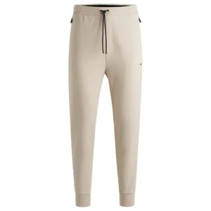 Stretch tracksuit bottoms with logo patch
