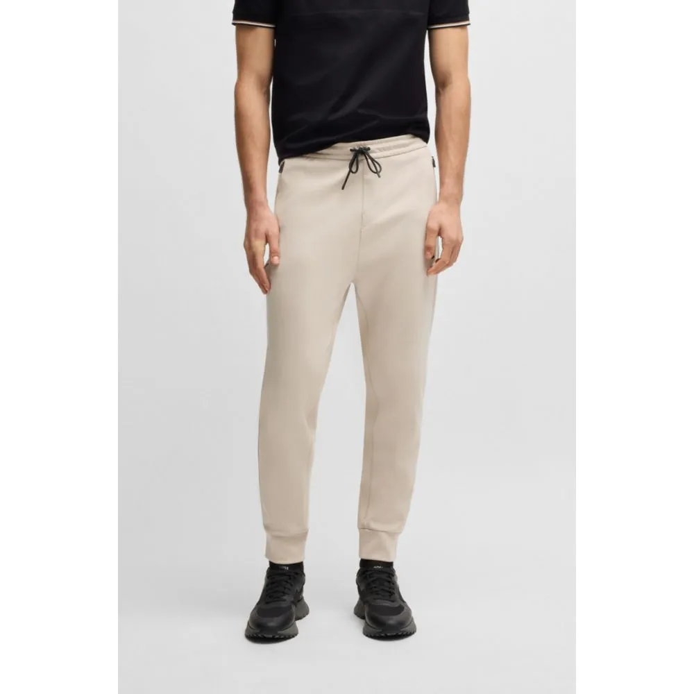 Stretch tracksuit bottoms with logo patch