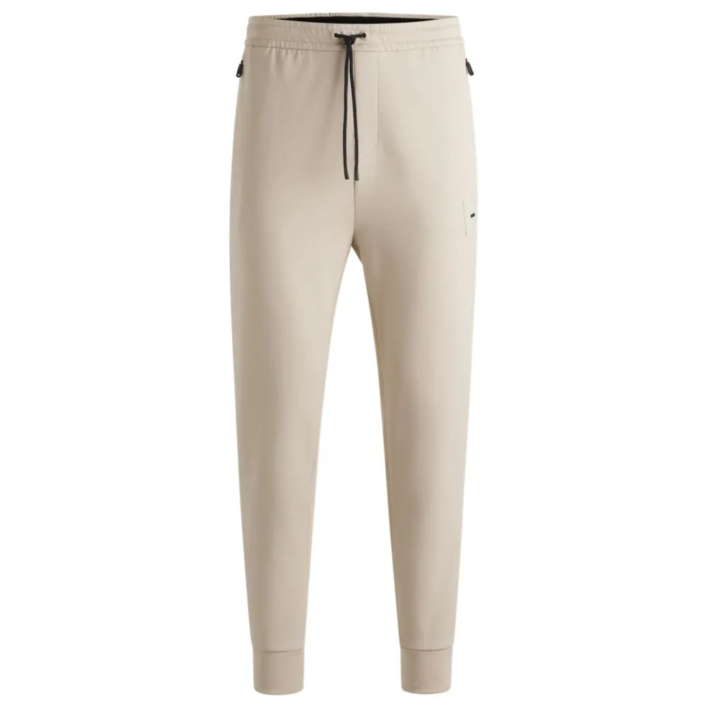 Stretch tracksuit bottoms with logo patch
