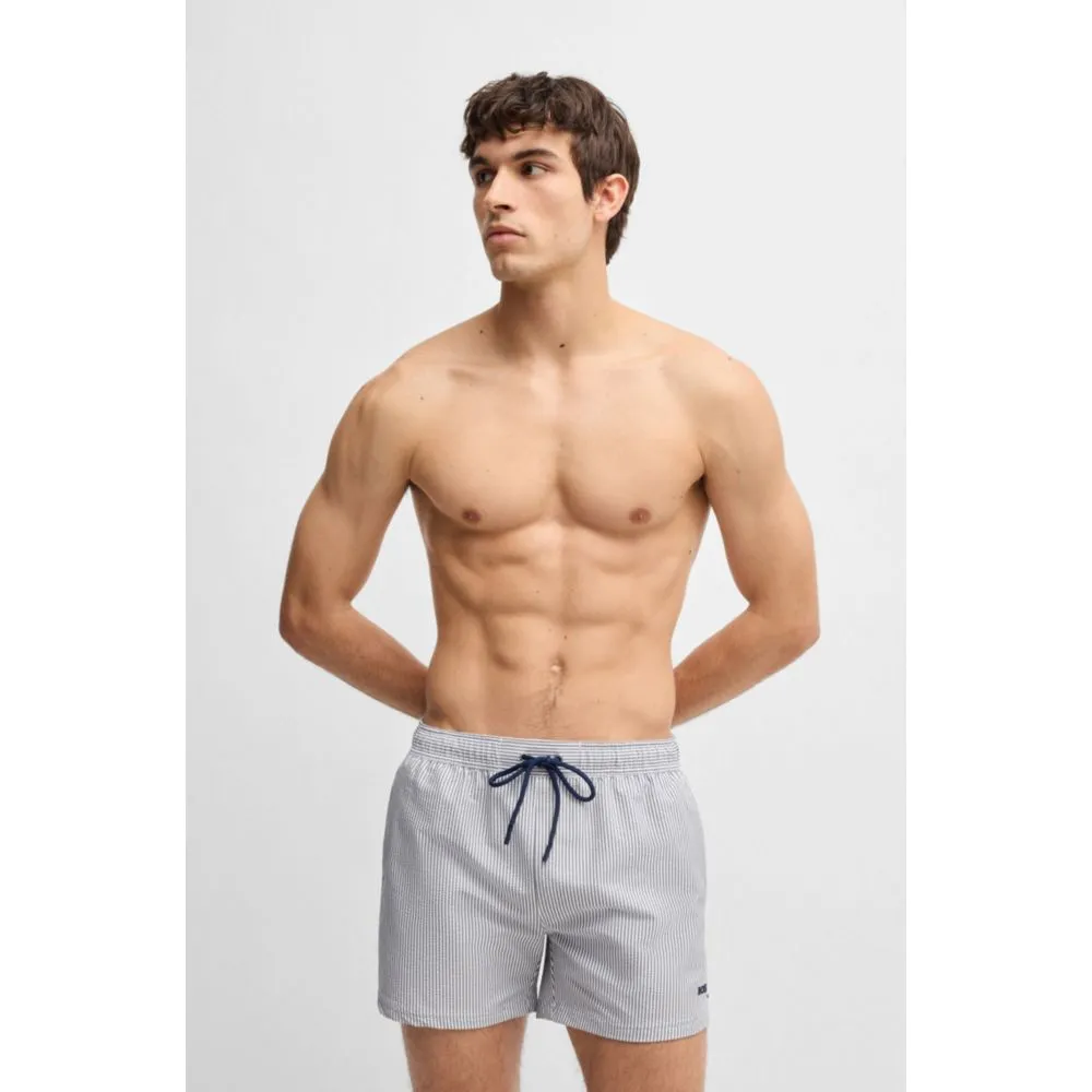 Swim shorts in striped seersucker fabric