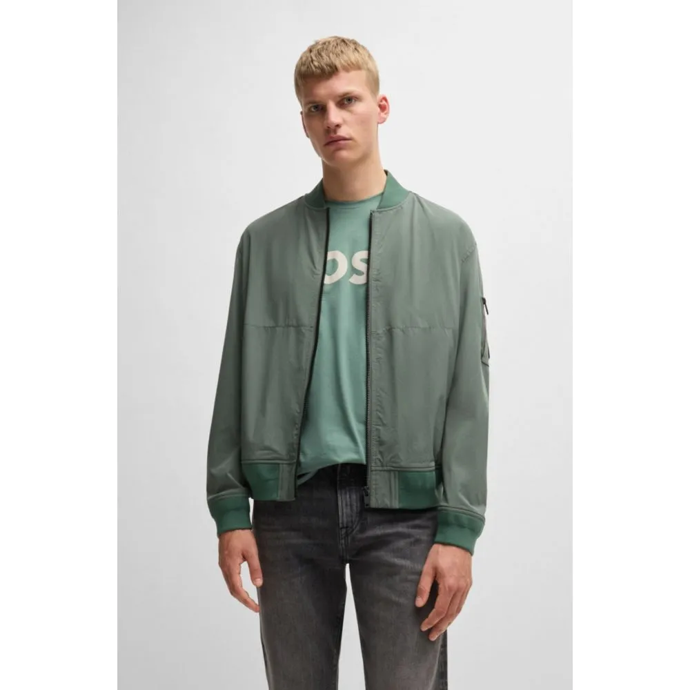 Water-repellent jacket with zipped sleeve pocket